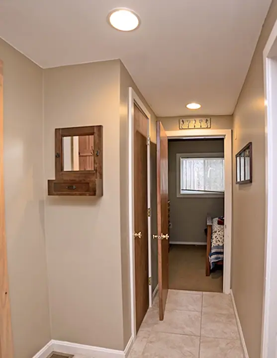 Hallway into home bedroom on left-bathroom straight ahead