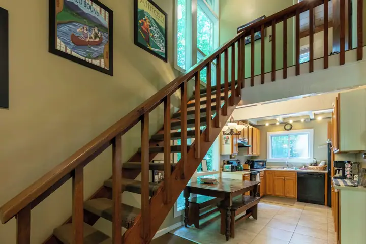 Stairs to two more bedrooms and a full bathroom