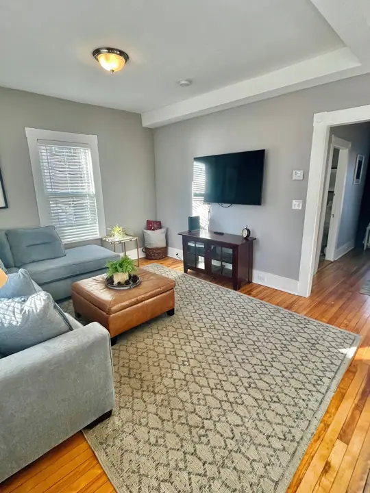 Living room off dining room, Nice big flat screen and Brand new couch