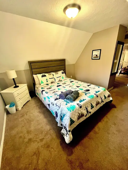 Another queen bedroom room with the king bedroom to the right