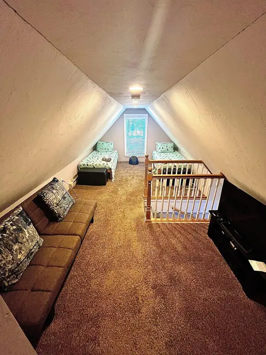Loft bedroom with TV and Nintendo switch