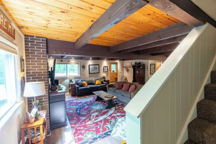 View of living room going up to third floor