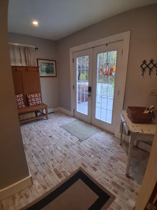Entrance mud room with real brick flooring