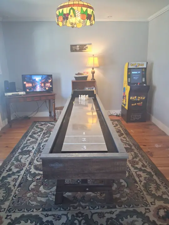 Game room with shuffleboard and a Pac-Man arcade