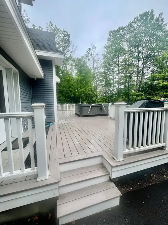 Side deck with hot tub , deck furniture and BBQ grill