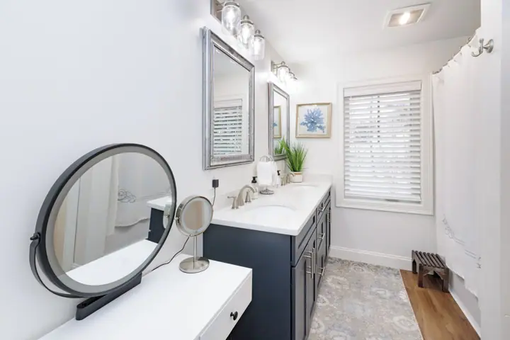 Full bath with vanity and make up mirror off queen bedroom first floor