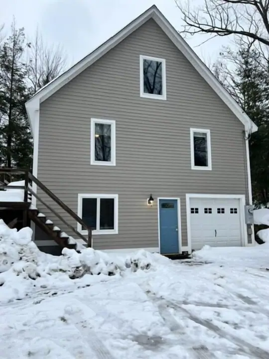 Exterior of home surrounded by trees