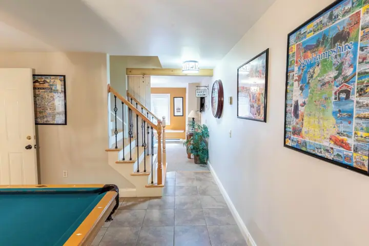 Lower level, stairs go up to main floor and guest room straight ahead
