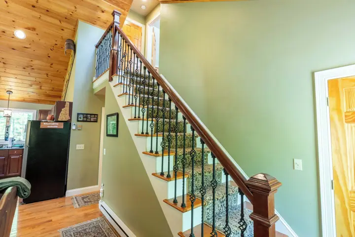 Stairs from living room going to third level