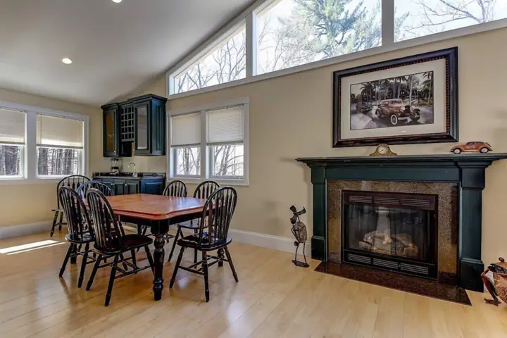 Another gas fireplace in upper kitchen living room area