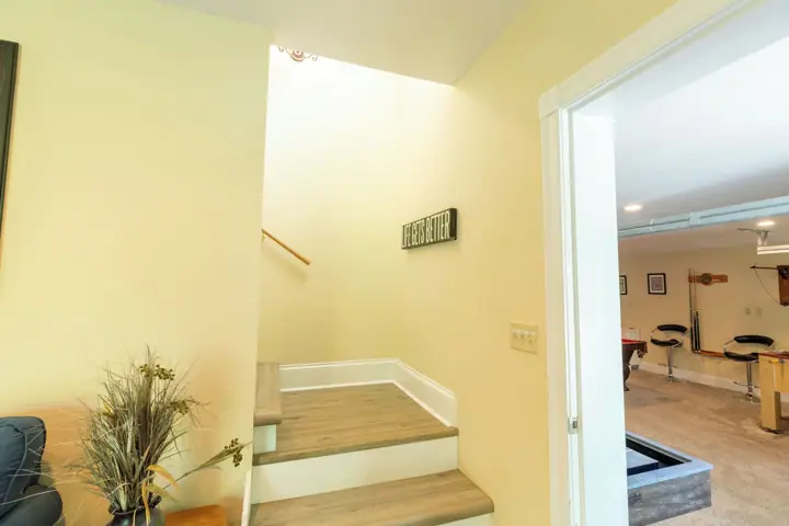 Game room to left stairs to upper level